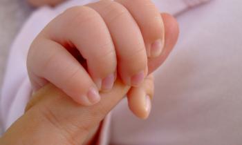 Baby grasping finger